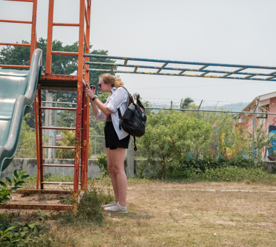 A Mercer student tests for lead on playground equipment in Belize.