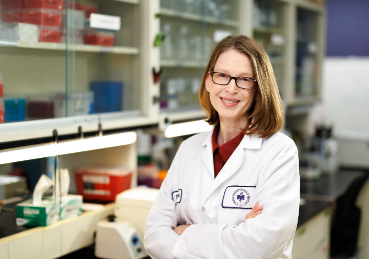 Dr. Pamela Cook in a laboratory.